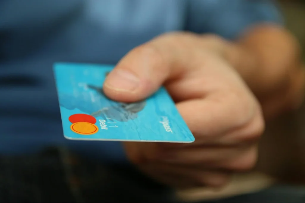 Image of a person making a payment for ecommerce services.