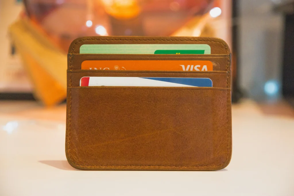Various credit cards in a wallet, all affected by different credit card surcharge rules.