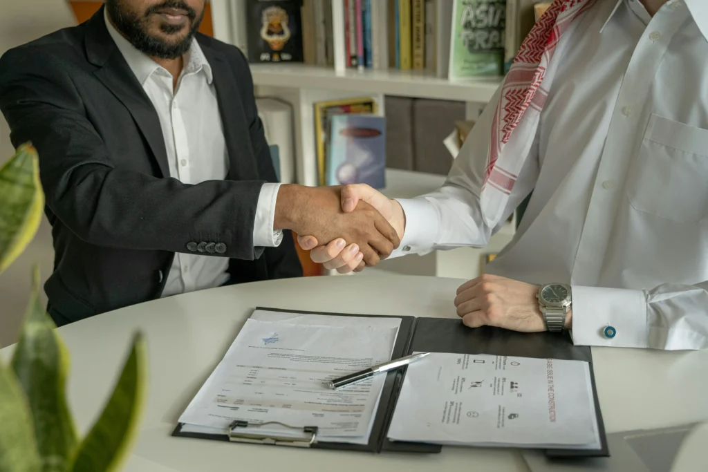 A business owner negotiating merchant account terms with their account manager.