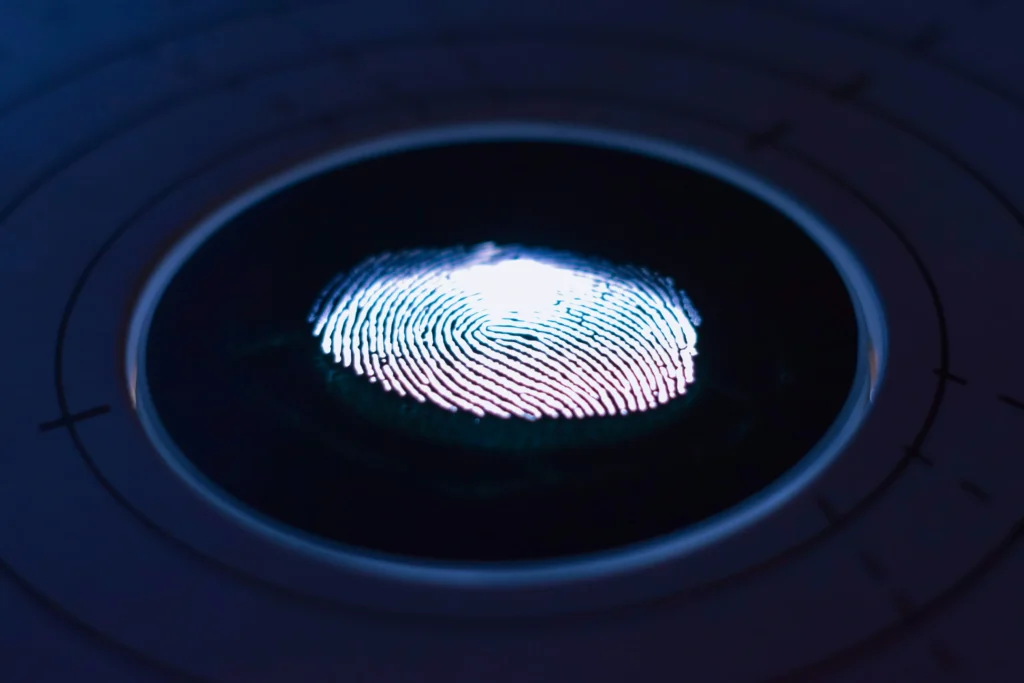 A customer using fingerprint verification while making a contactless purchase.