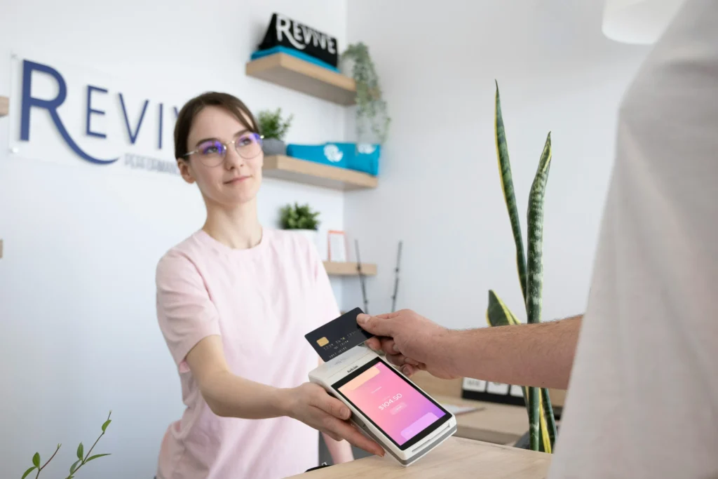 A customer using tap to pay for goods and services.