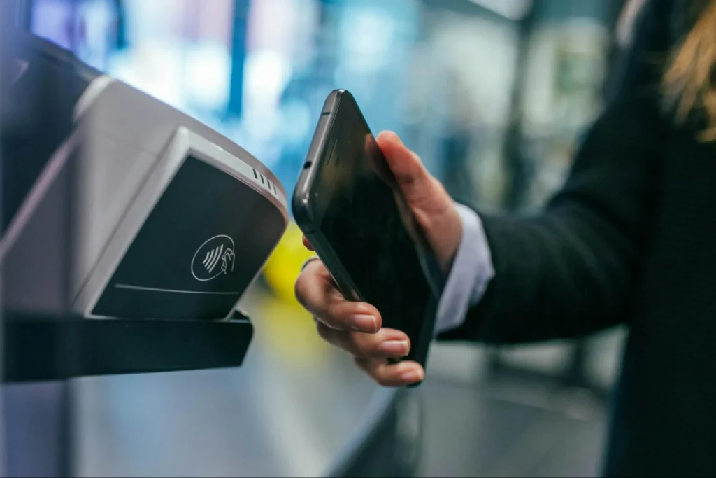 A customer using tap and pay with a smartphone.