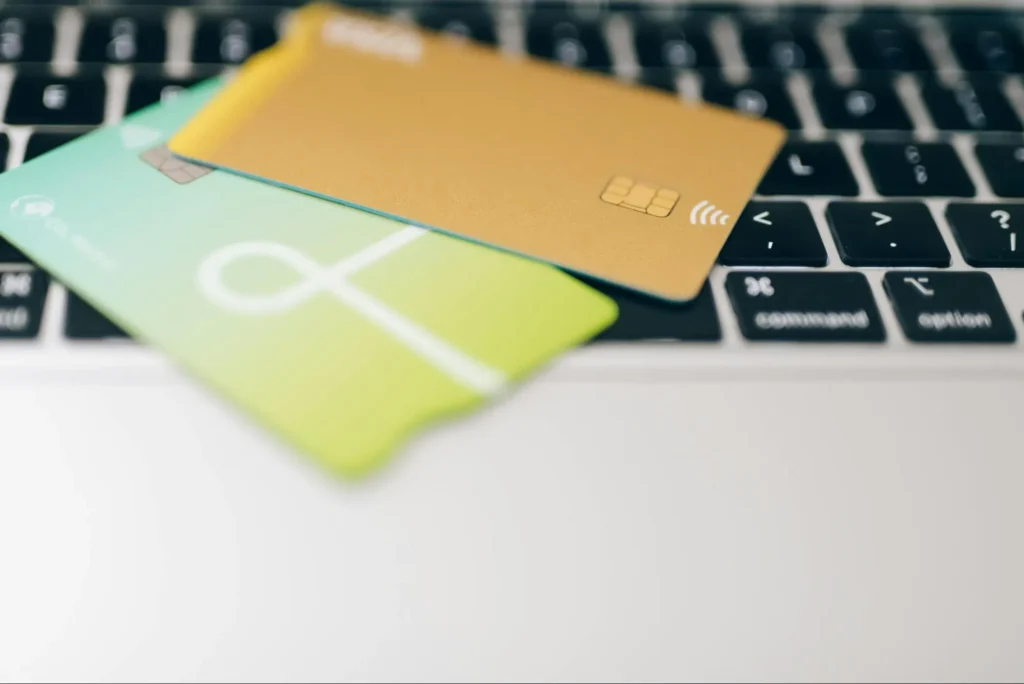 Credit cards on a laptop representing digital payments facilitated by TPPPs.