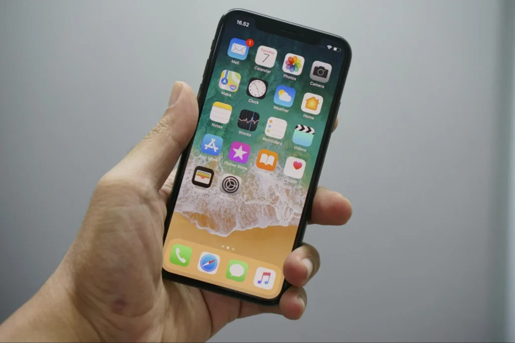 A customer using an iPhone for tap and pay transactions.