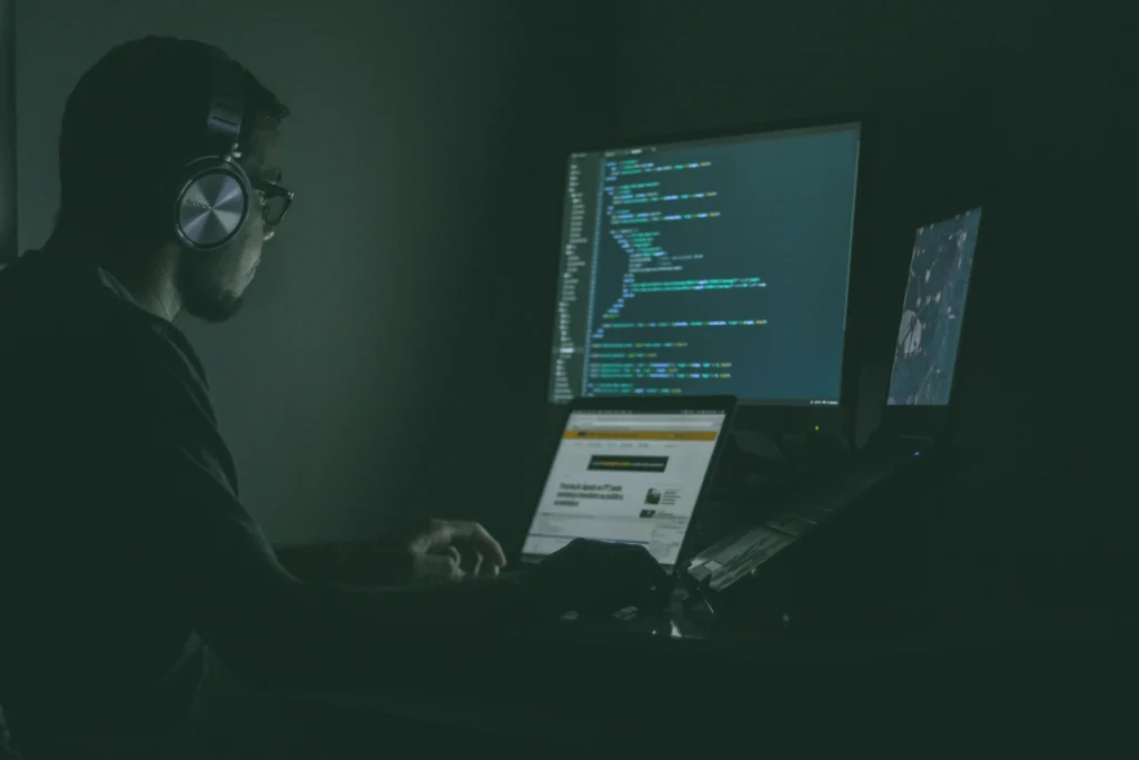 A scammer running a computer despite the protection that AI provides.