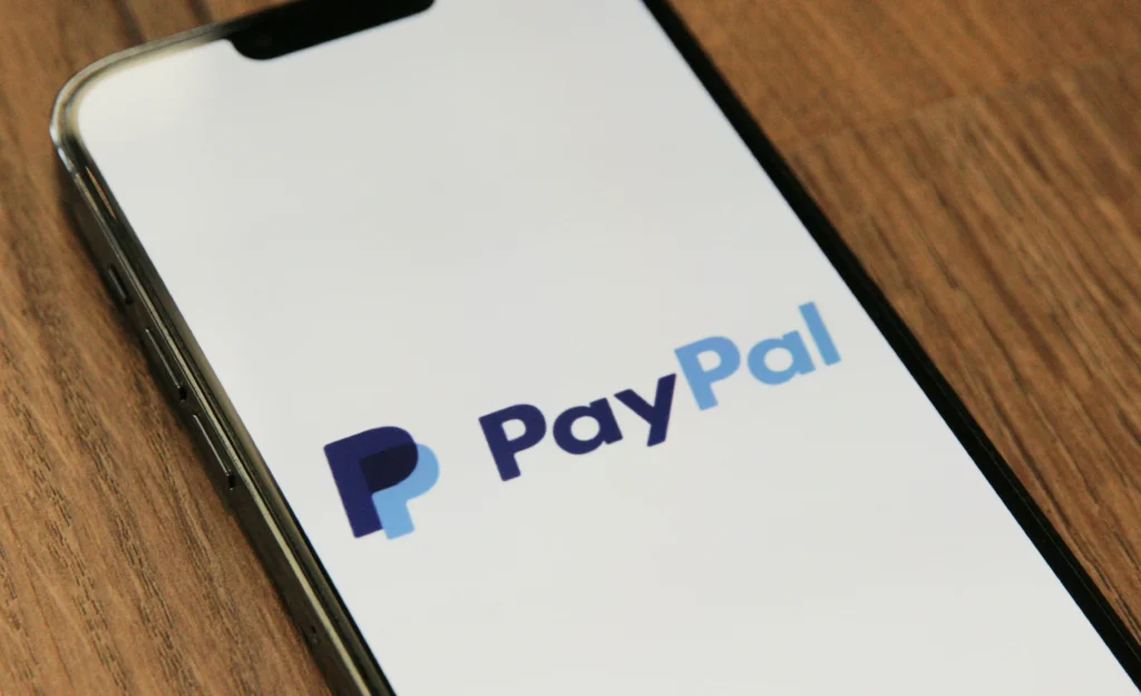 A smartphone displaying the PayPal logo.