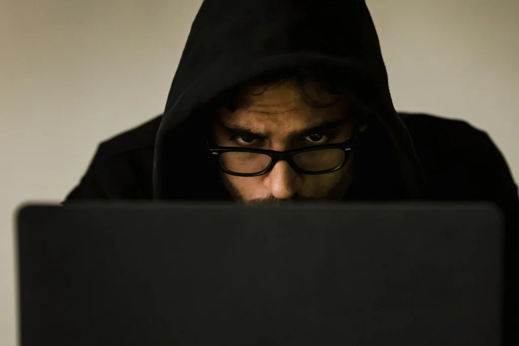 A hacker attempting to commit financial fraud.