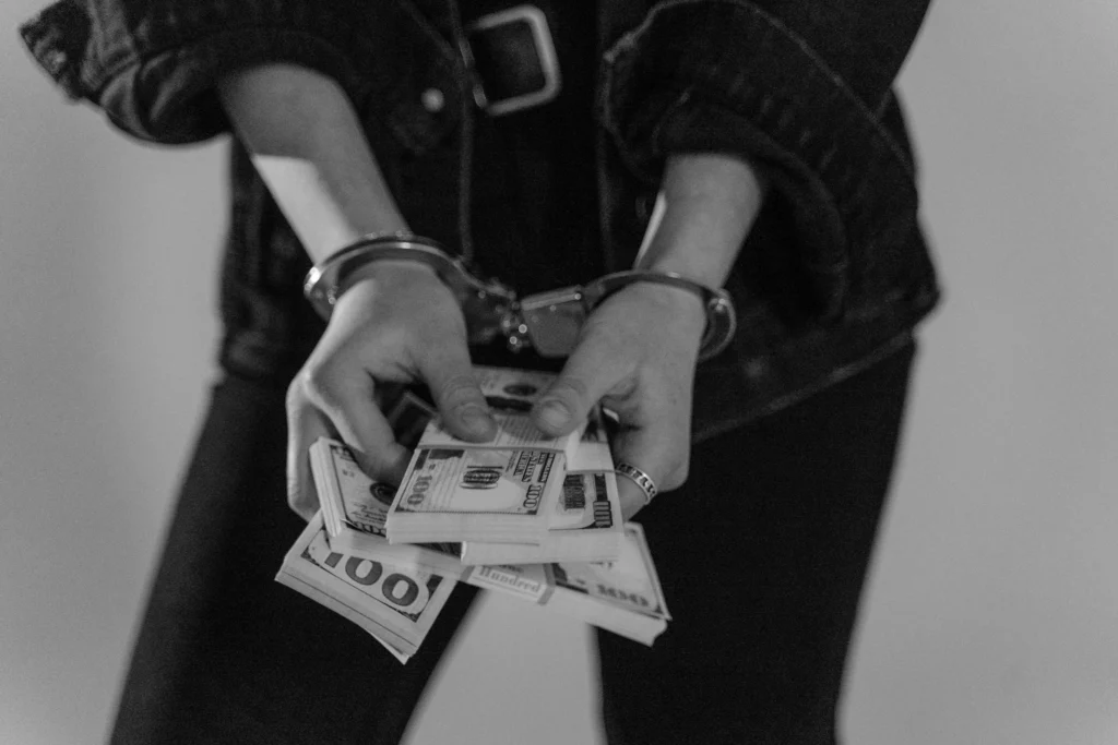 A person found guilty of money laundering, triggering businesses to implement AML compliance for stronger protections.