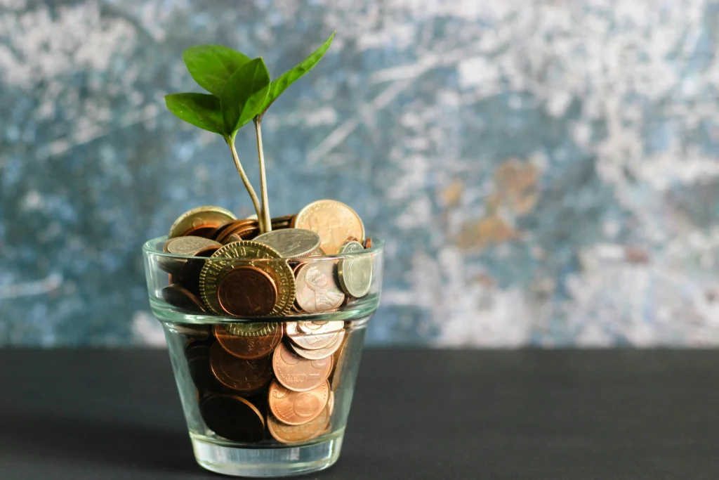 A pot of loose change, indicating how savings grow when you find an affordable payment processor.