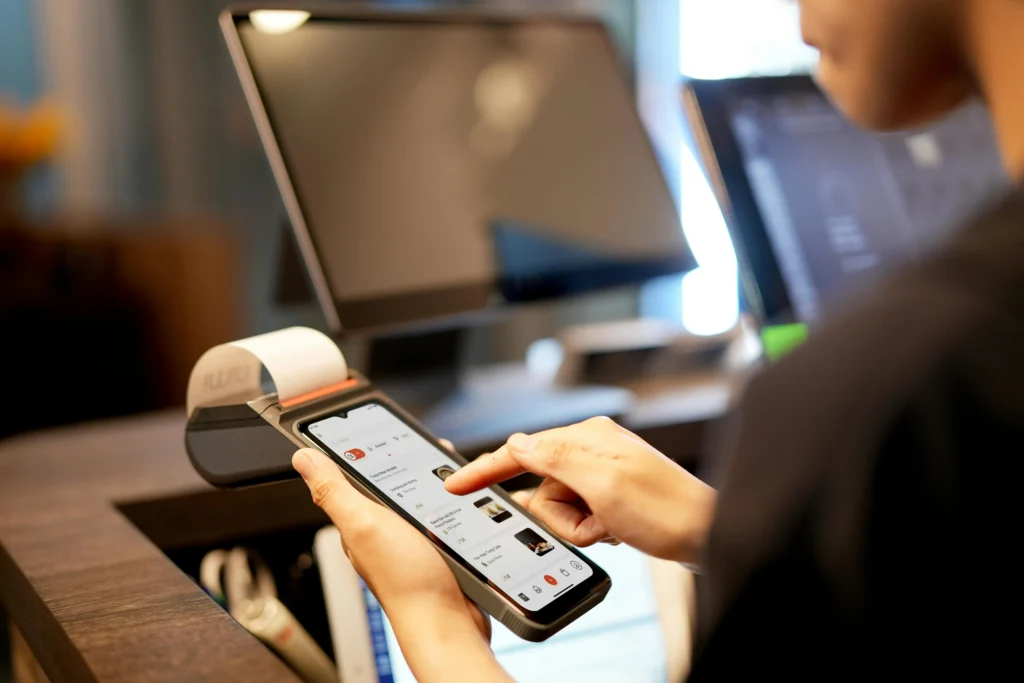 A customer making a mobile payment for goods and services.