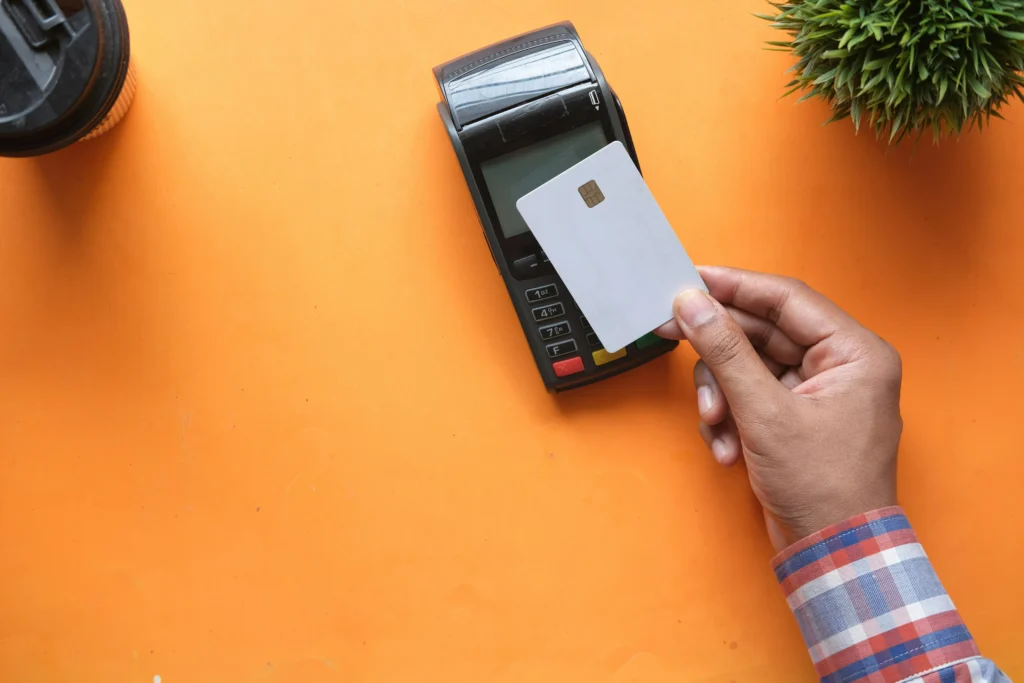 A customer making a contactless debit card payment.