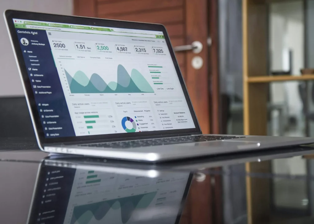 A business owner’s laptop with detailed analytics, helping to form pre-arbitration defense.