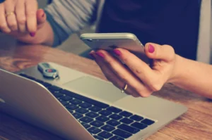 A person making an online payment to a business using a VPOS system.