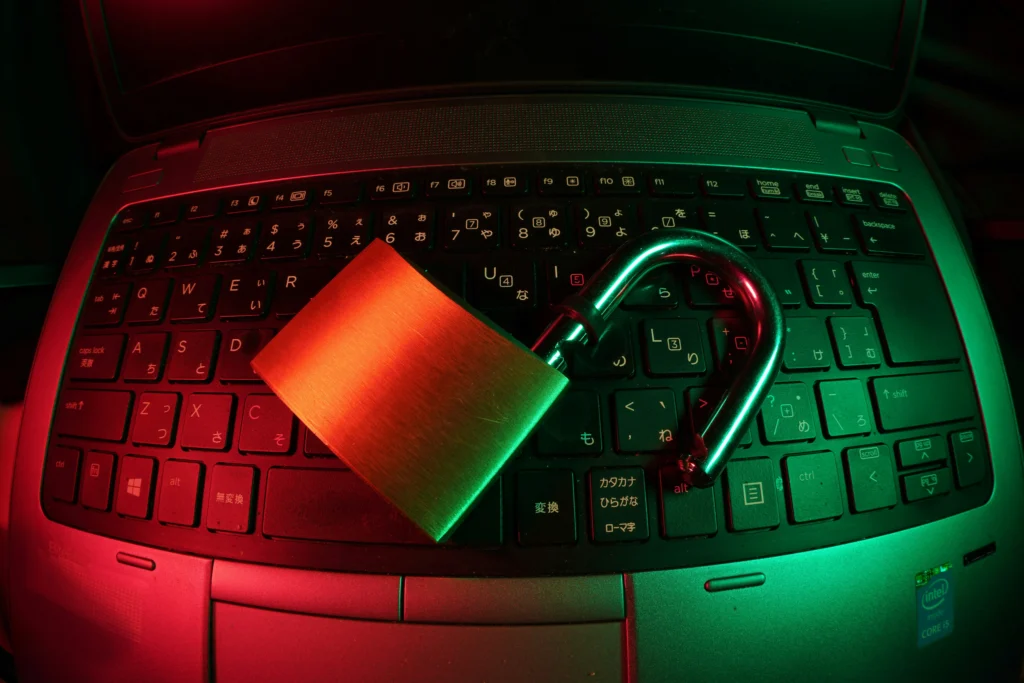A laptop computer and padlock, signifying a need for strong payment security systems to protect against fraud.