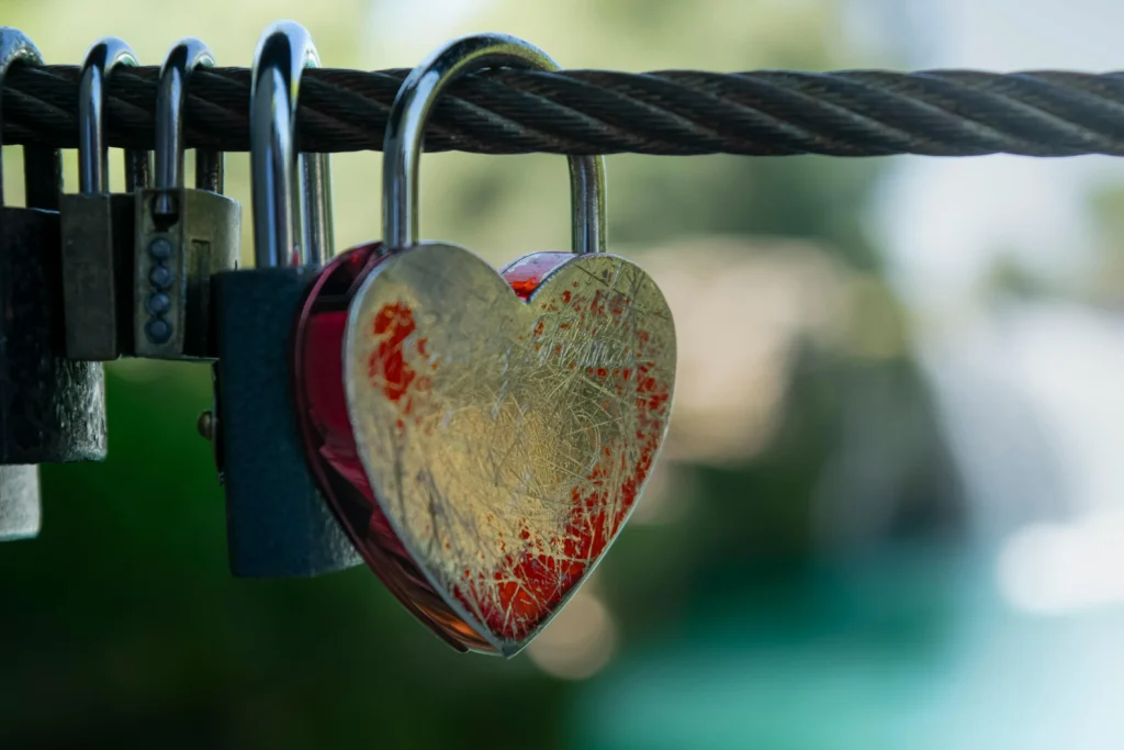 A heart-shaped padlock, representing the emotional attachment some businesses form with credit card vault providers.