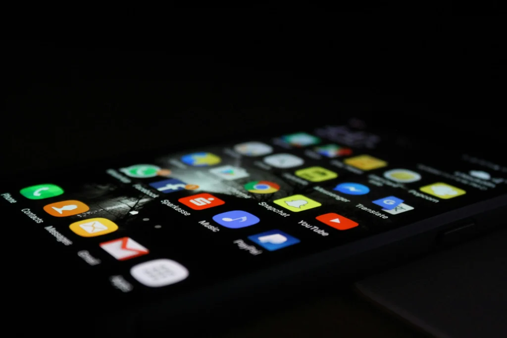 A smartphone featuring several apps that contain embedded finance mechanisms.